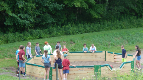 Group of youth in and around the gaga pit.