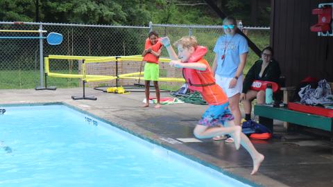 Youth Jumping in the Pool