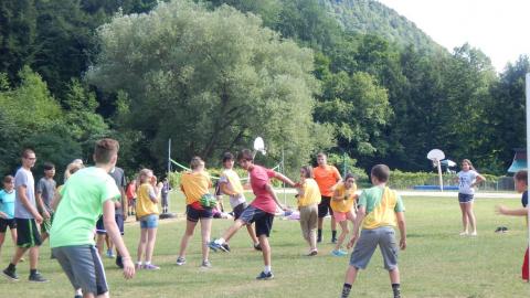 Campers playing a camp-wide game outside on the lawn.