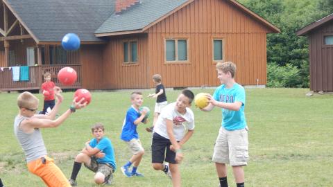 Campers playing dodgeball. 