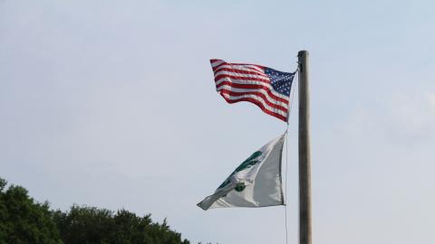 American and 4-H flags waving in the breeze.