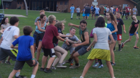 campers trying to pull the flag from counselors pocket during game of safari.