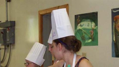 Youth working on recipes during a cooking class. 