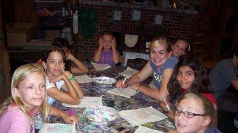 group of youth in the craft hall coloring.