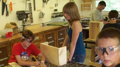 Youth work on wood shop projects. 