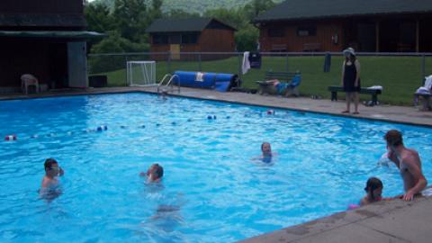 youth swimming in pool.