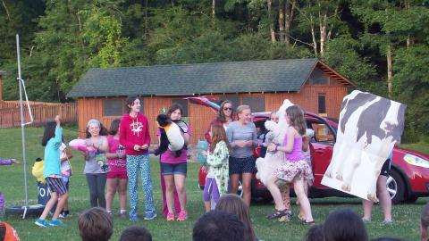 Campers put on a show using animal props. 