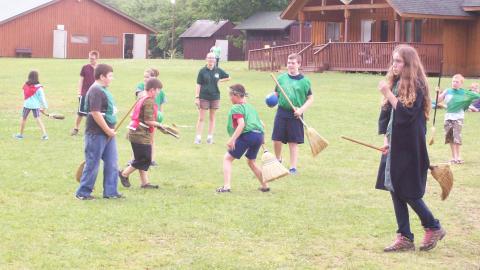 Youth play a friendly game of quidditch. 