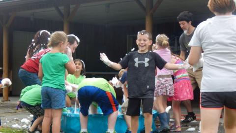 Campers playing with bubbles. 