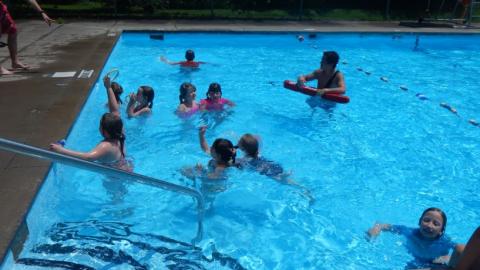 Campers take lessons in the camp swimming pool. 