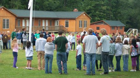Campers and counselors alike gathered around the flagpole.
