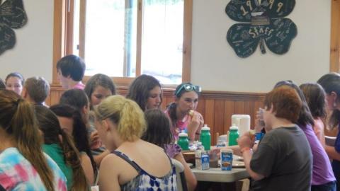 Youth eat a meal in the dining hall. 