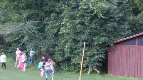 Youth playing a game outside. 