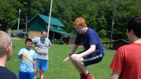 Campers playing jump rope. 