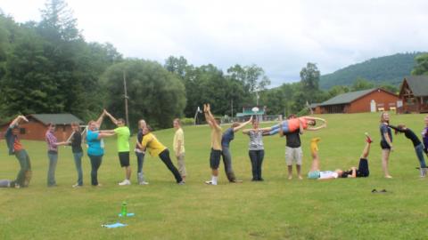 Staff spelling "4-H Shankitunk!" with their bodies 