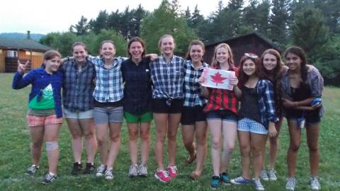 group of campers holding a Canadian flag 