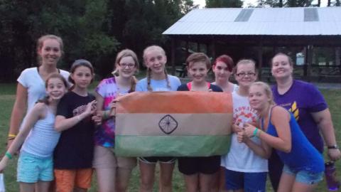 Campers posing with handmade Indian flag