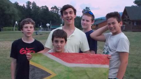 campers posing with flag