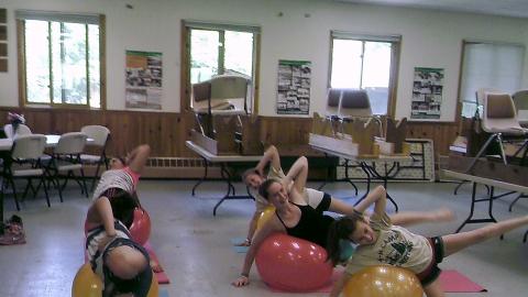 campers do yoga with rubber balls 