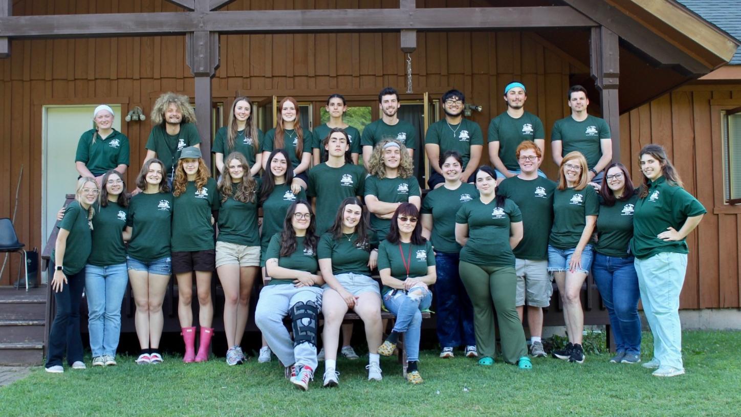 Group photo of camp staff in Shankitunk T-shirts
